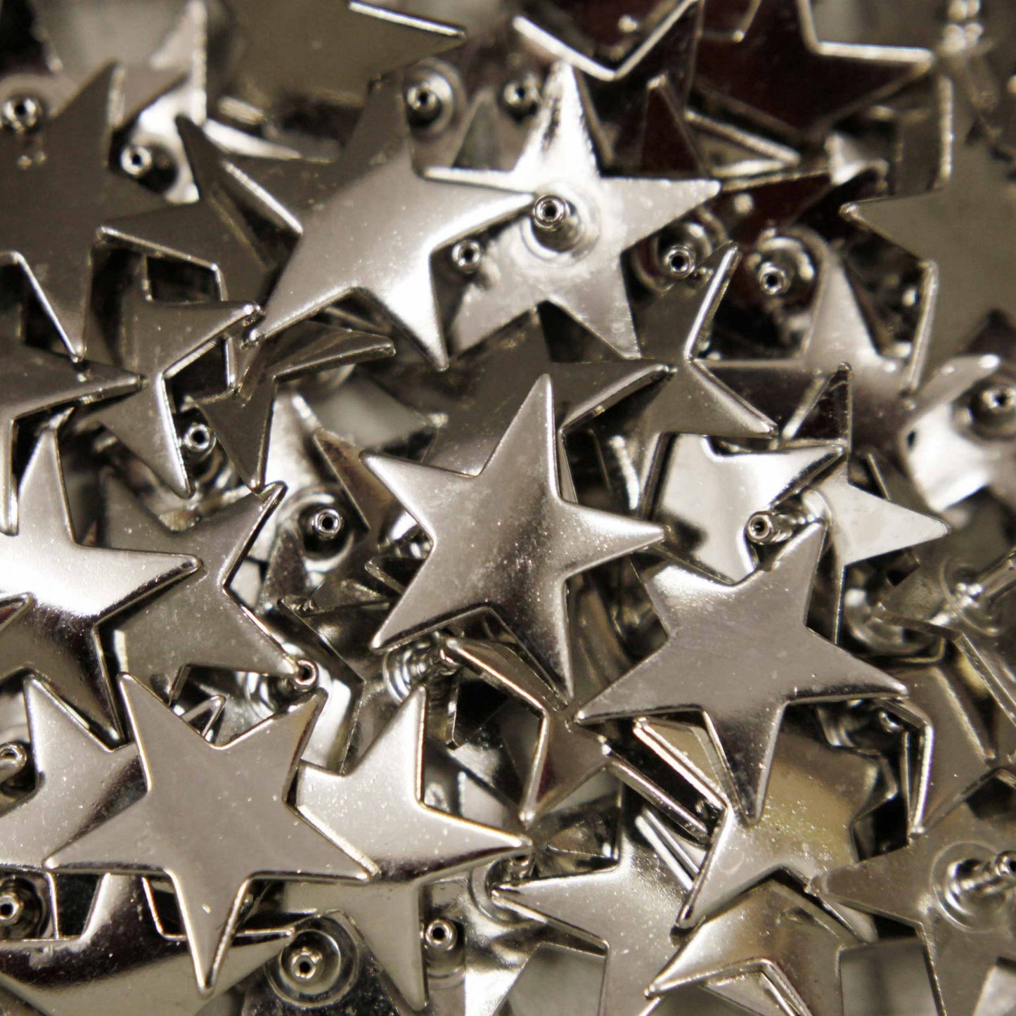 Silver star studs for dog collars in workshop, Creature Clothes